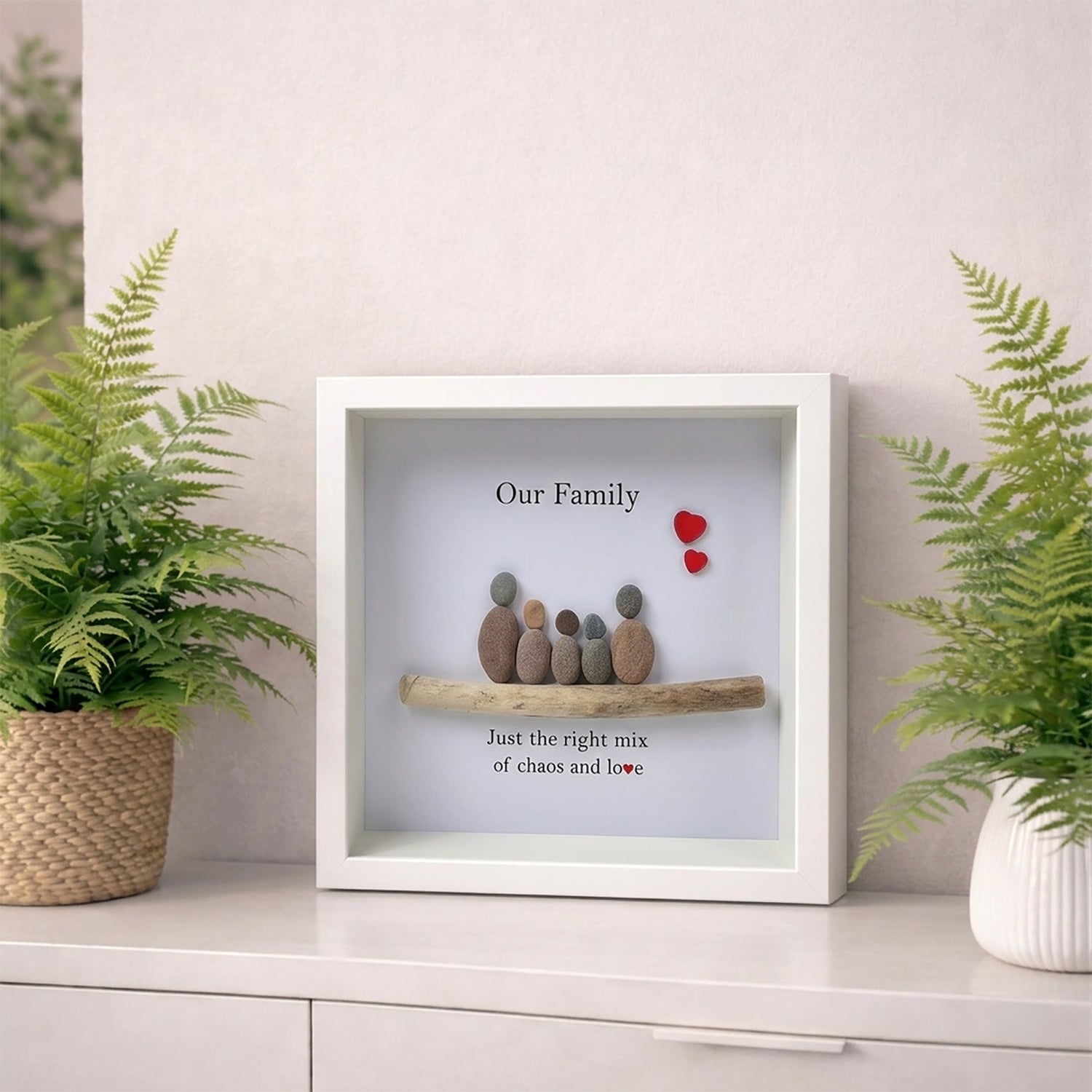 pebble picture frame perosnalised with 5 stones on sideboard