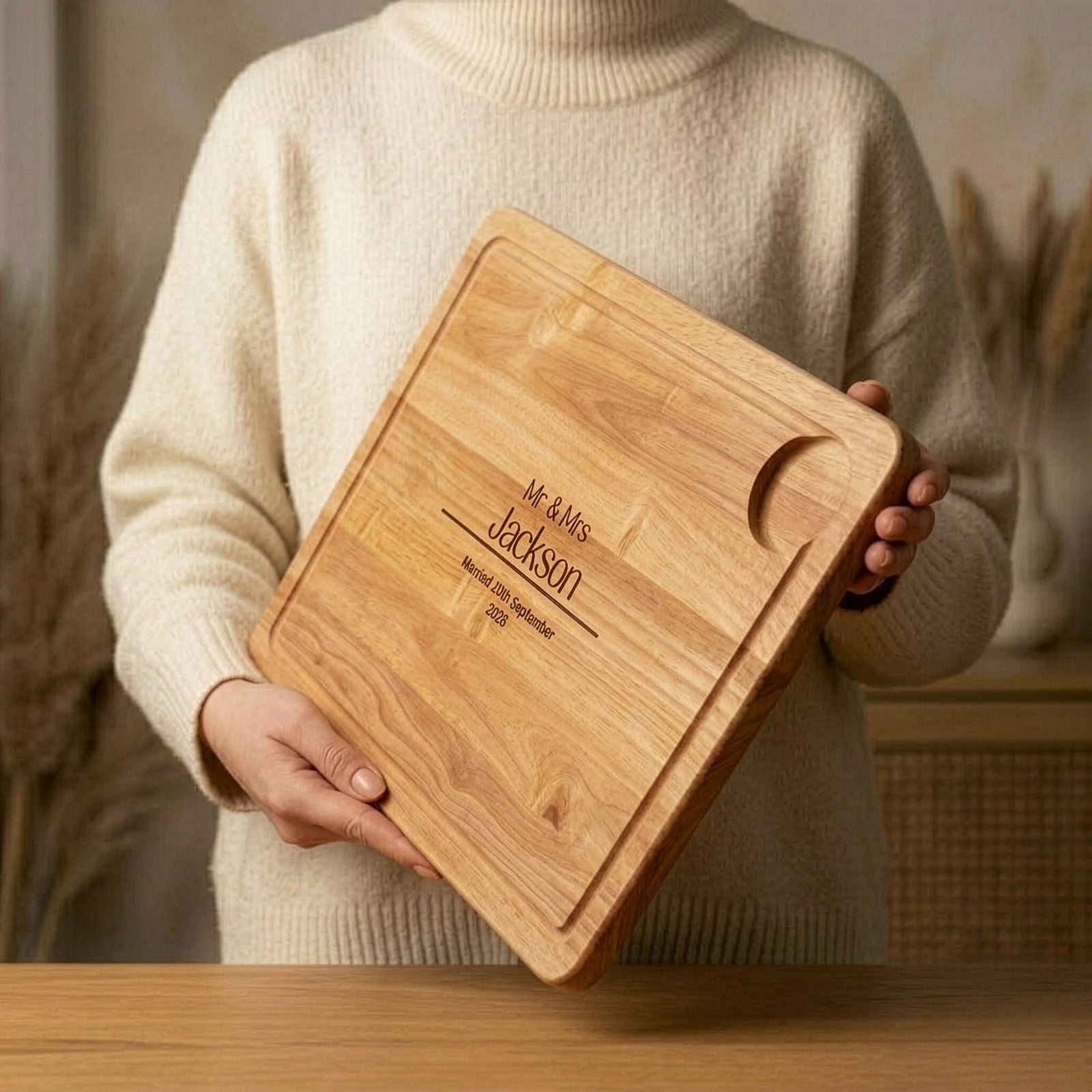 Personalised Mr & Mrs Wedding Chopping board being held at an angle showing thickness of board in the hands of a lady