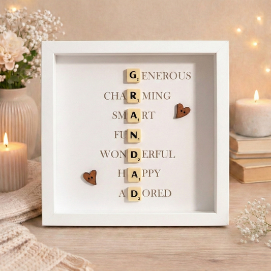 Decorative frame with wooden letters spelling out a message about a grandad, placed on a table with candles and flowers.
