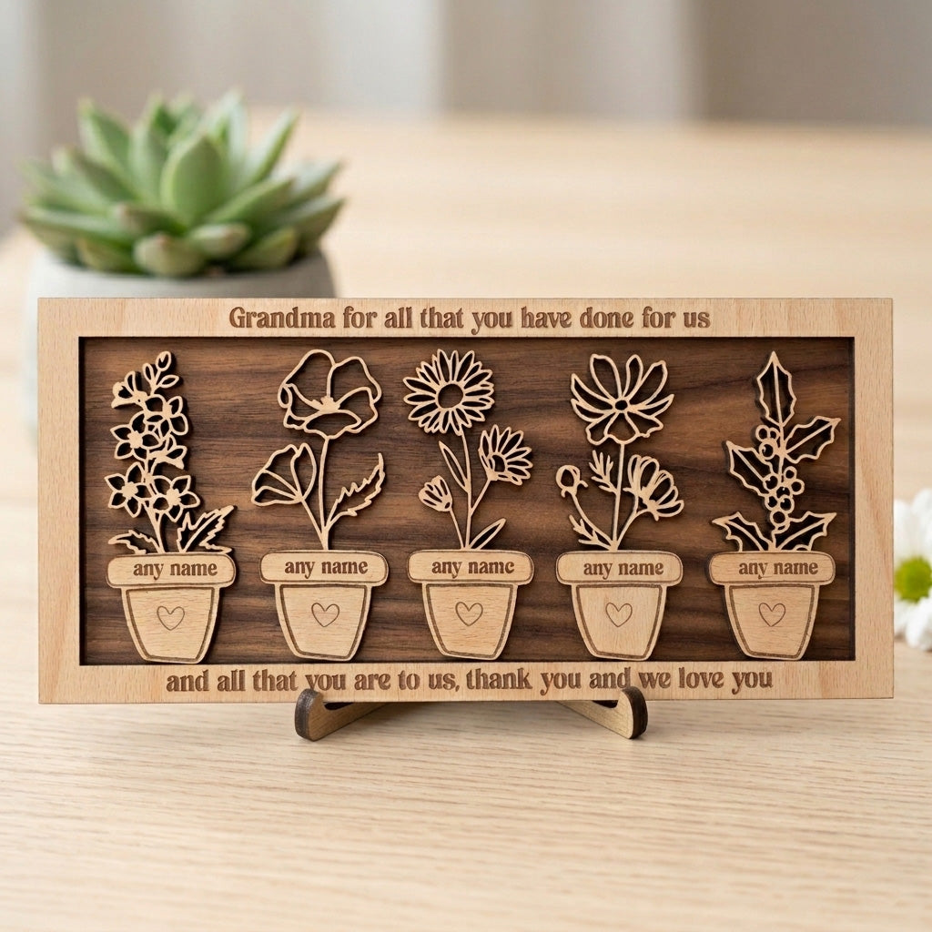 Personalised engraved wooden frame with laser cut floral designs and engraved text on a wooden stand.