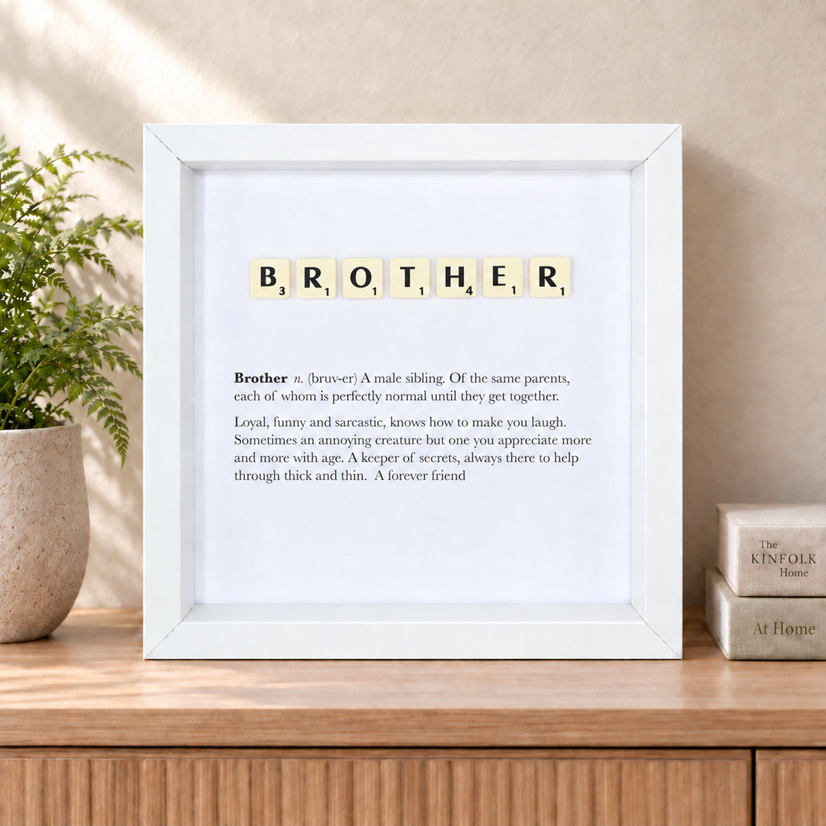 Brother Scrabble-style definition frame displayed in a styled home interior