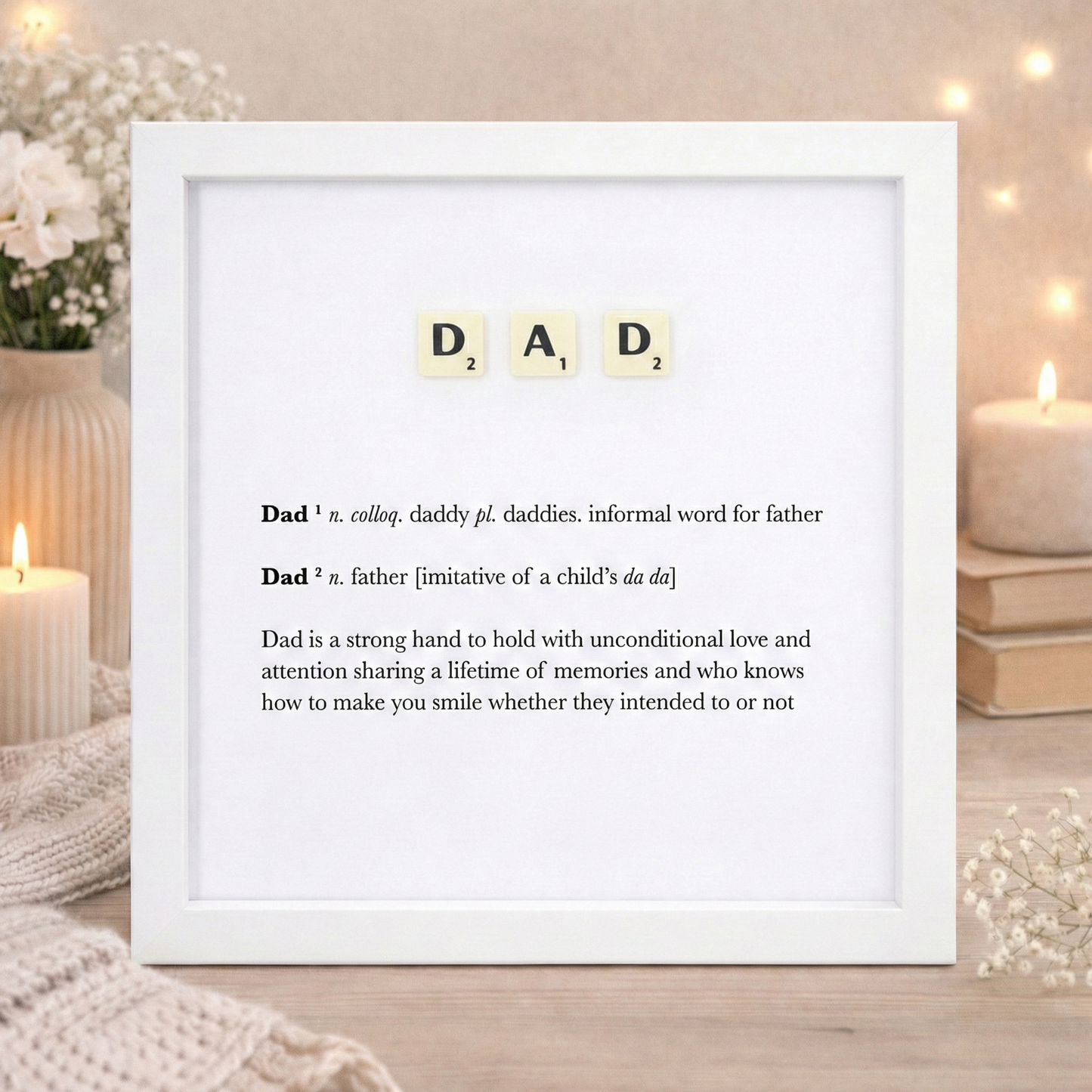 dad letters spelled out in scrabble in a white frame with a dictionary definition of the meaning of dad