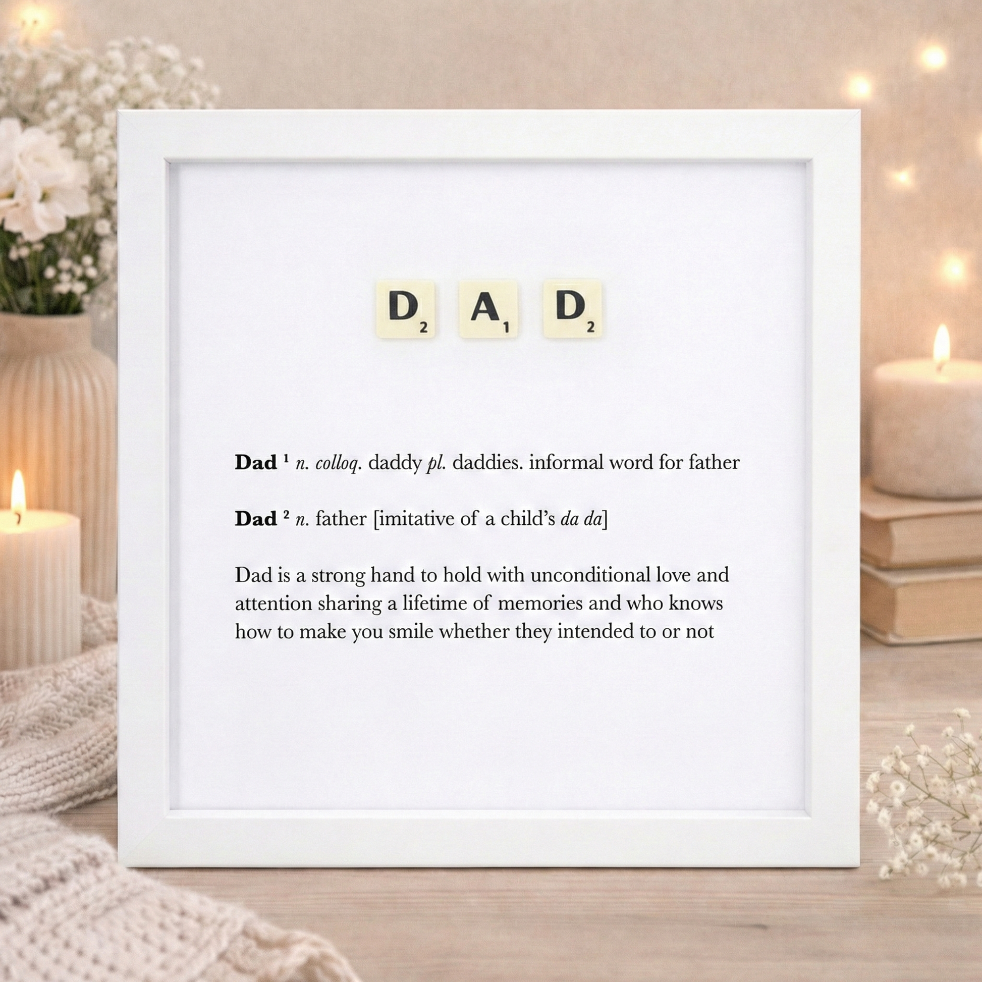 dad letters spelled out in scrabble in a white frame with a dictionary definition of the meaning of dad