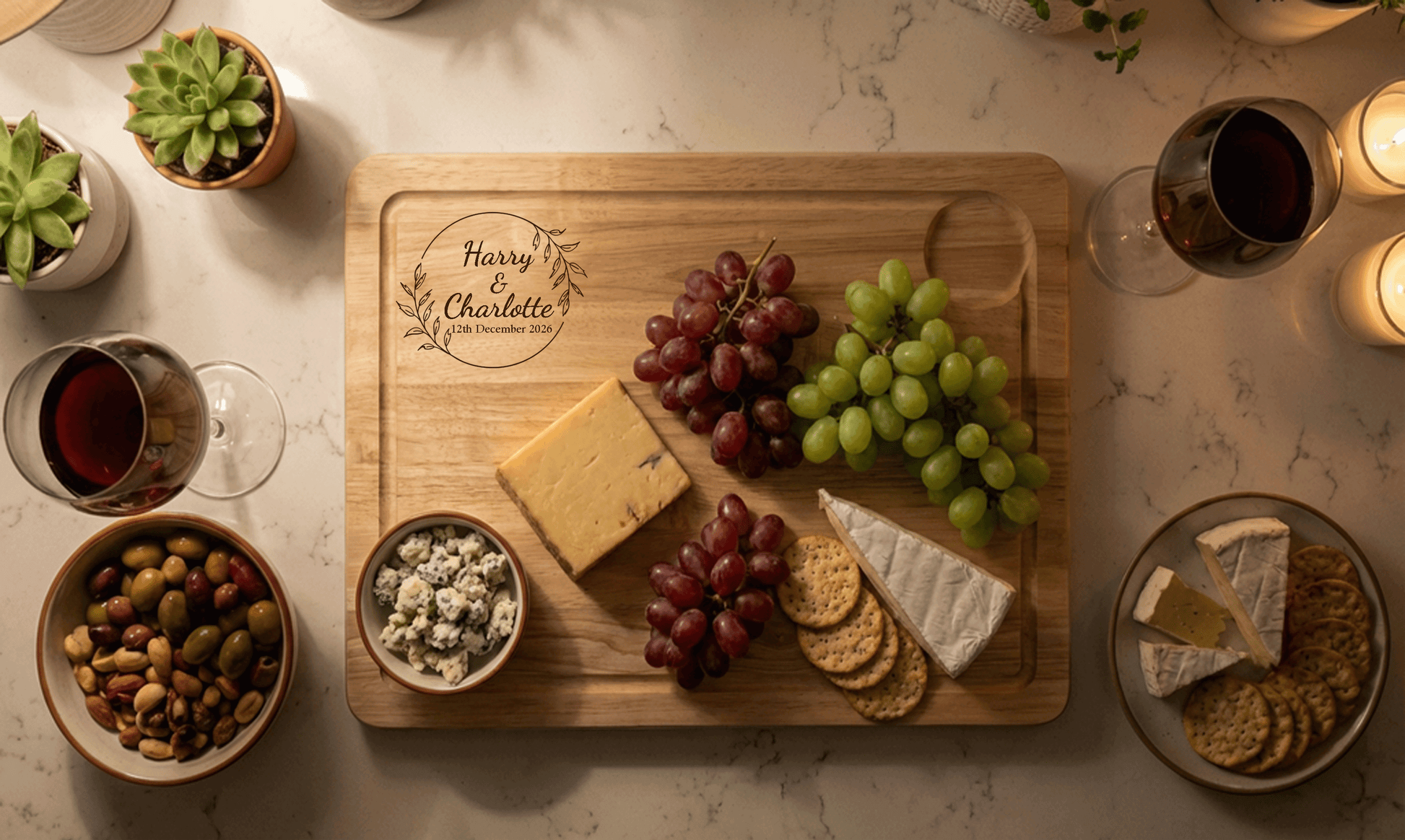 Custom engraved chopping and serving board with names and date, styled as a sharing platter with cheese and grapes