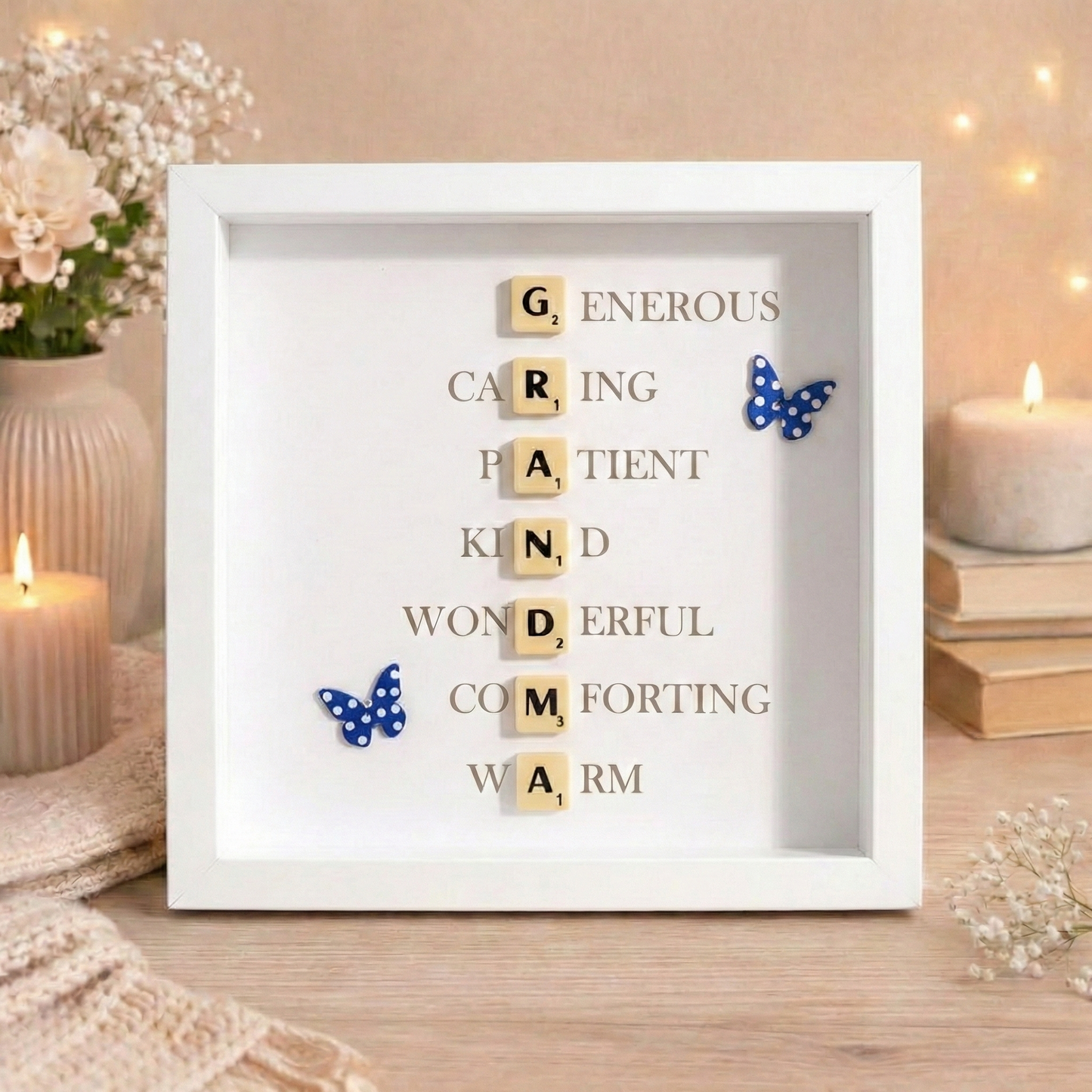 Decorative wall art with grandma spelt out in a vertical design in scrabble letters with butterflies in a white frame.