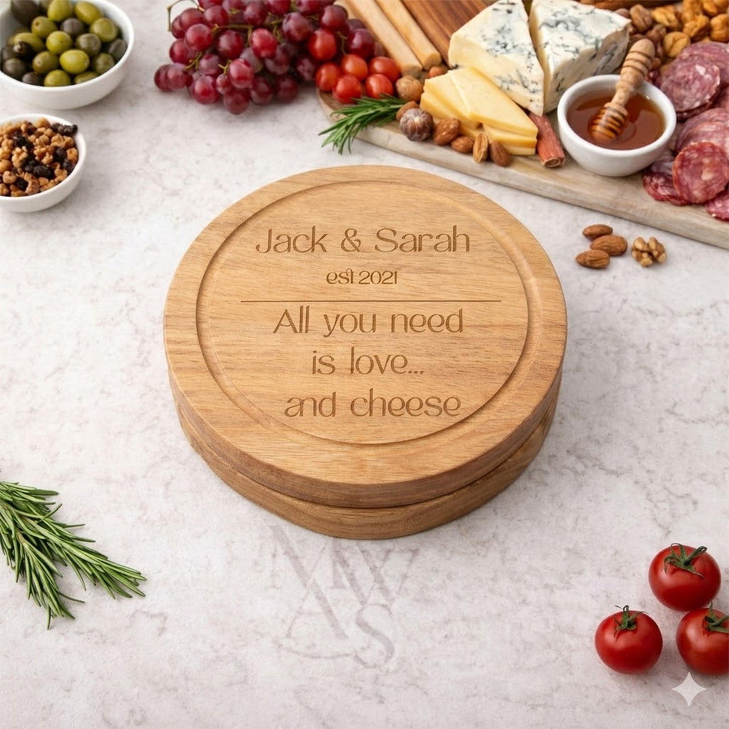 personalised cheeseboard closed with cheese and nibbles on worktop