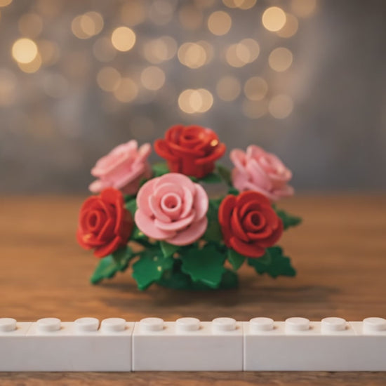 lego block being constructed with personalised picture and text on a wedding scene table