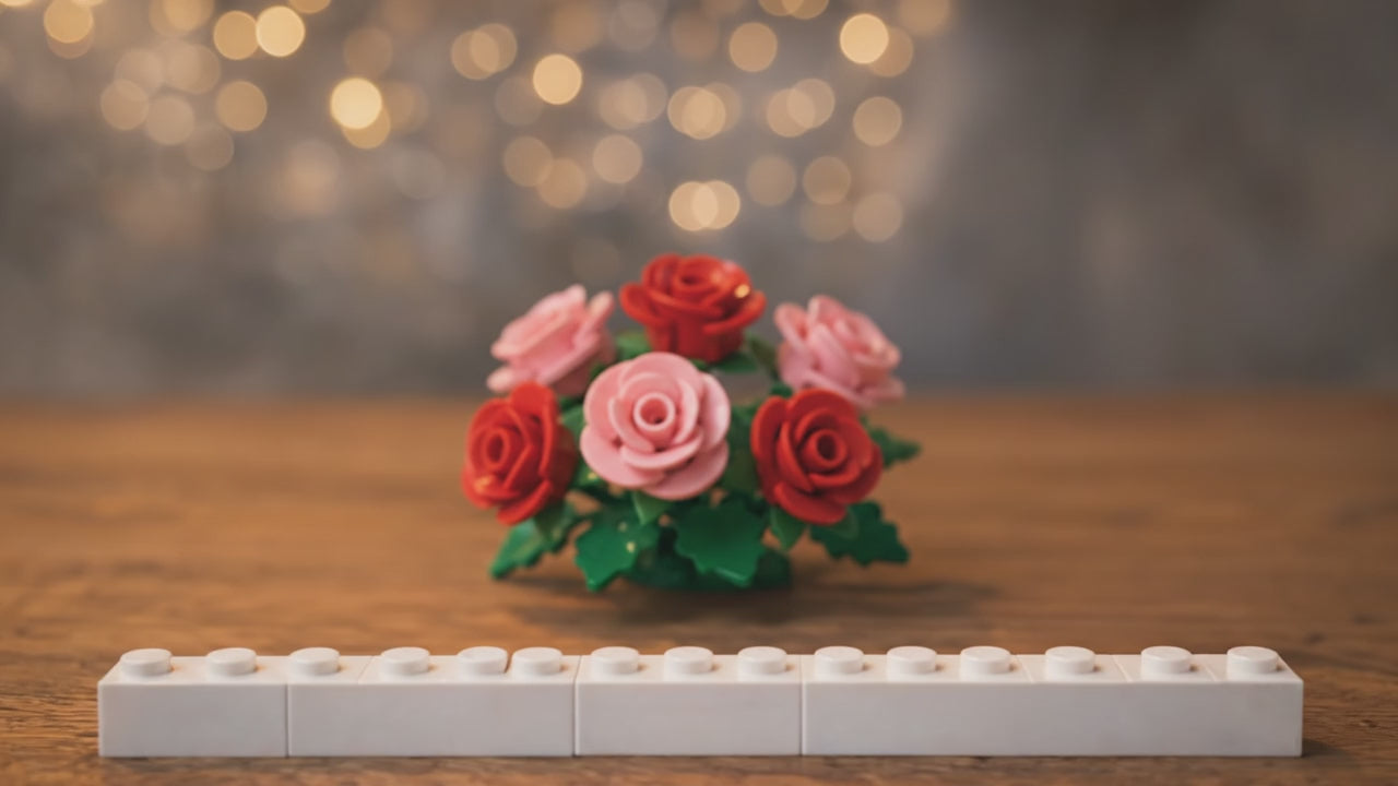 lego block being constructed with personalised picture and text on a wedding scene table